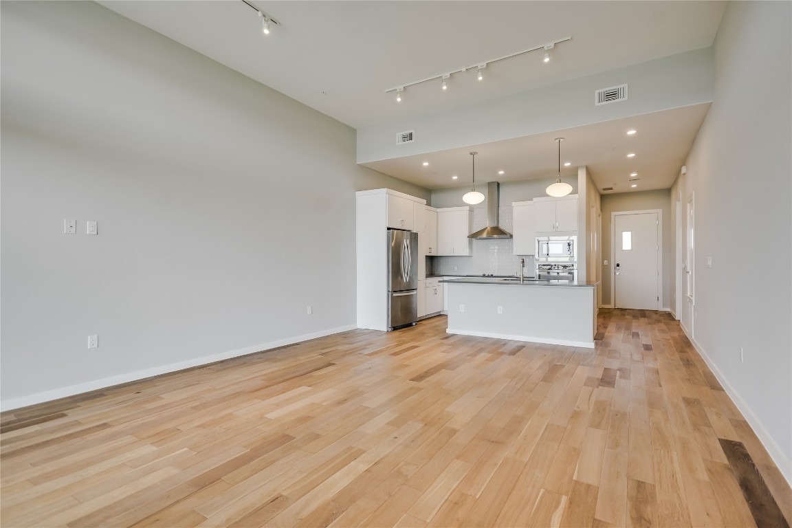 5921 Hiline Road, Unit 2403 Austin, TX 78734 - Photo 12 of 35 a view of kitchen with wooden floor