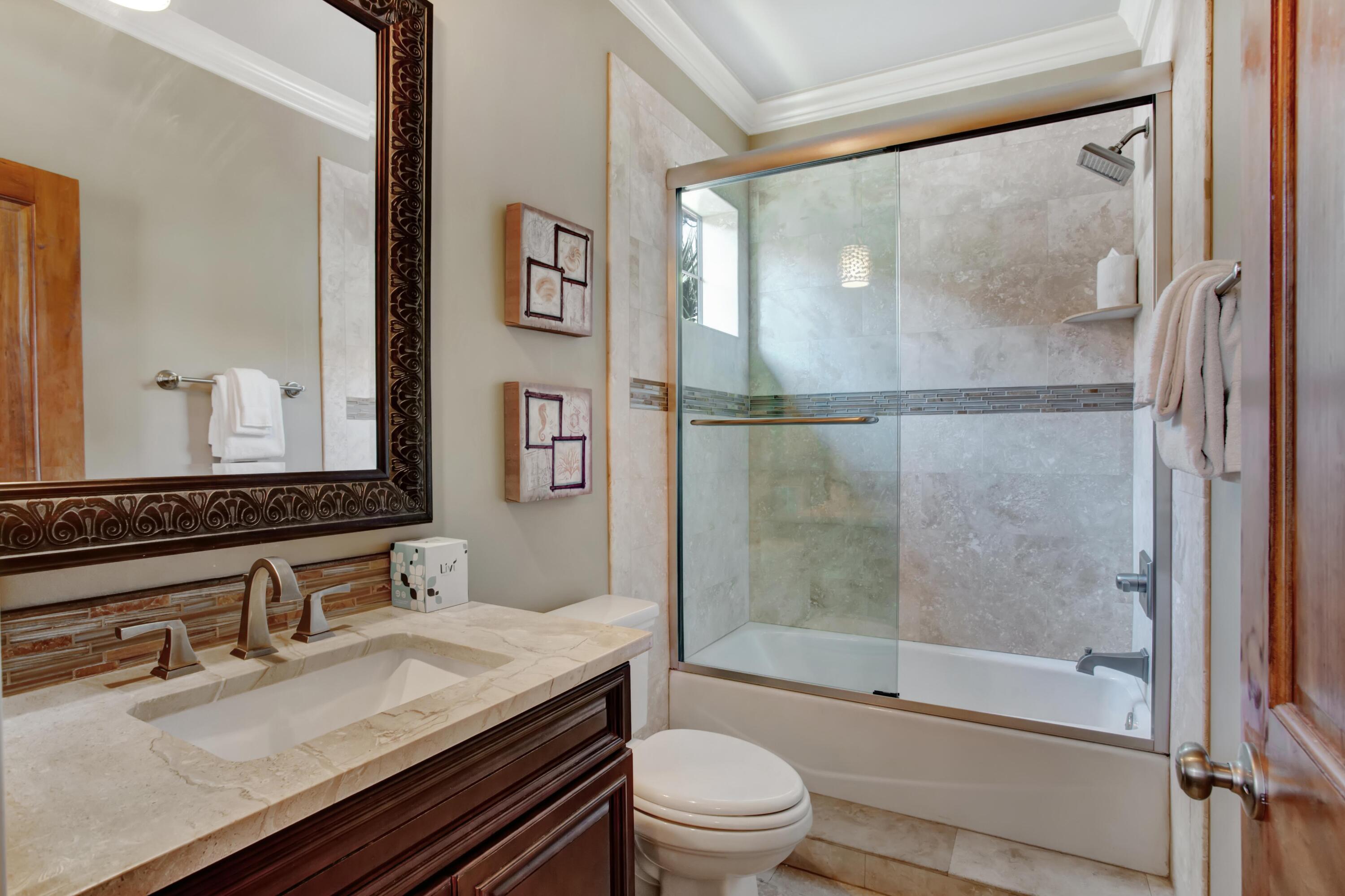 1917 Baytowne Loop Miramar Beach, FL 32550 - Photo 26 of 39 a bathroom with a granite countertop sink toilet and shower