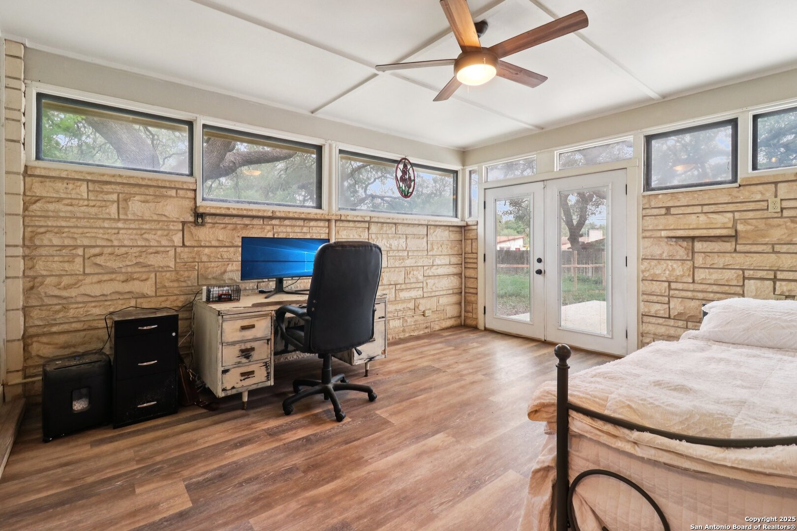 503 Mockingbird Lane Devine, TX 78016 - Photo 14 of 49 a view of a workspace with furniture and a window