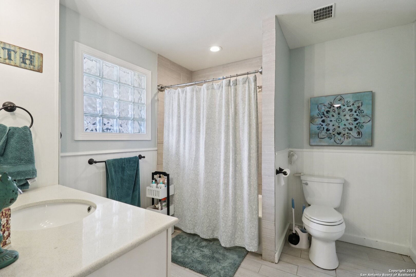 503 Mockingbird Lane Devine, TX 78016 - Photo 18 of 49 a bathroom with a sink toilet and shower