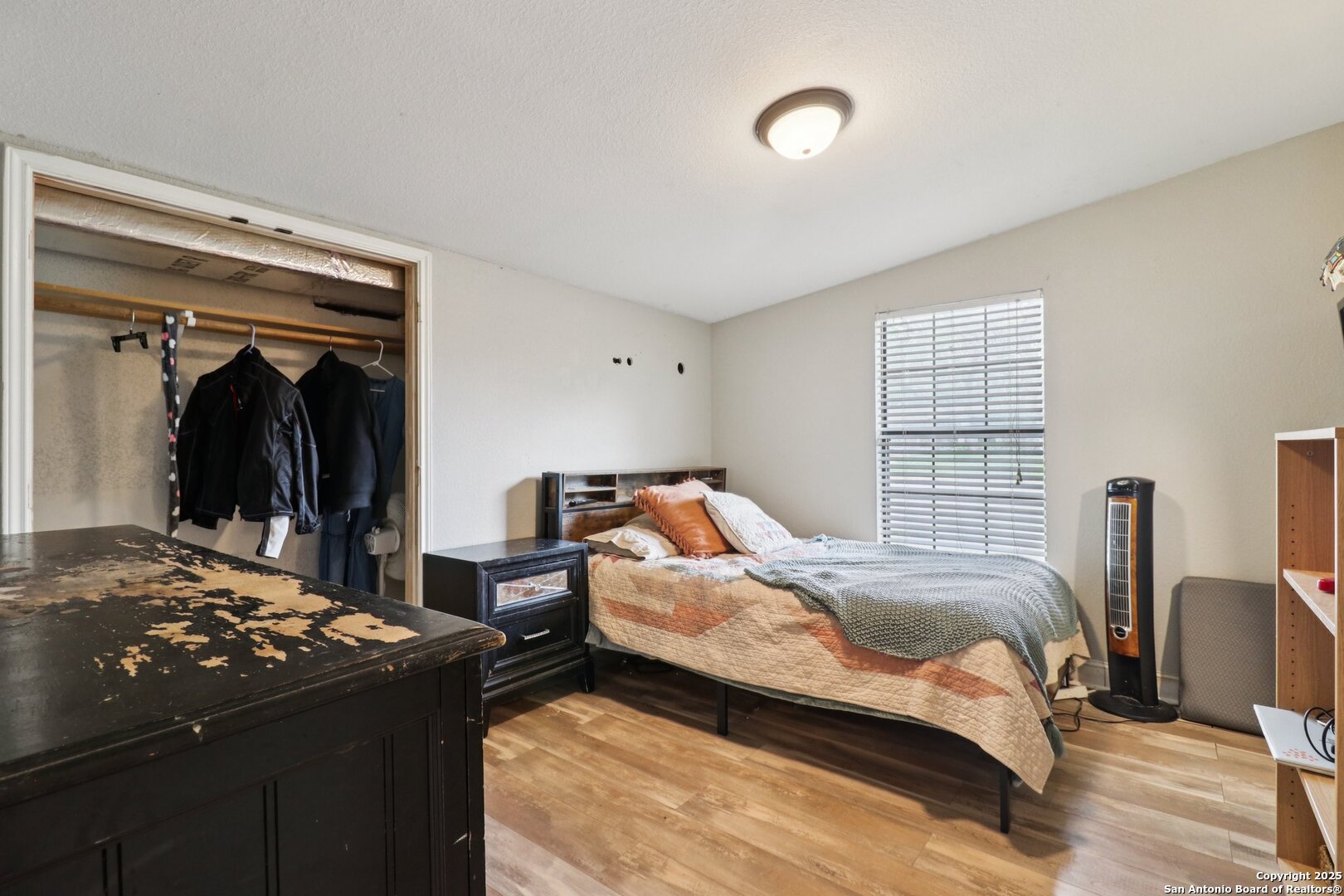 503 Mockingbird Lane Devine, TX 78016 - Photo 22 of 49 a bedroom with a bed and a mirror