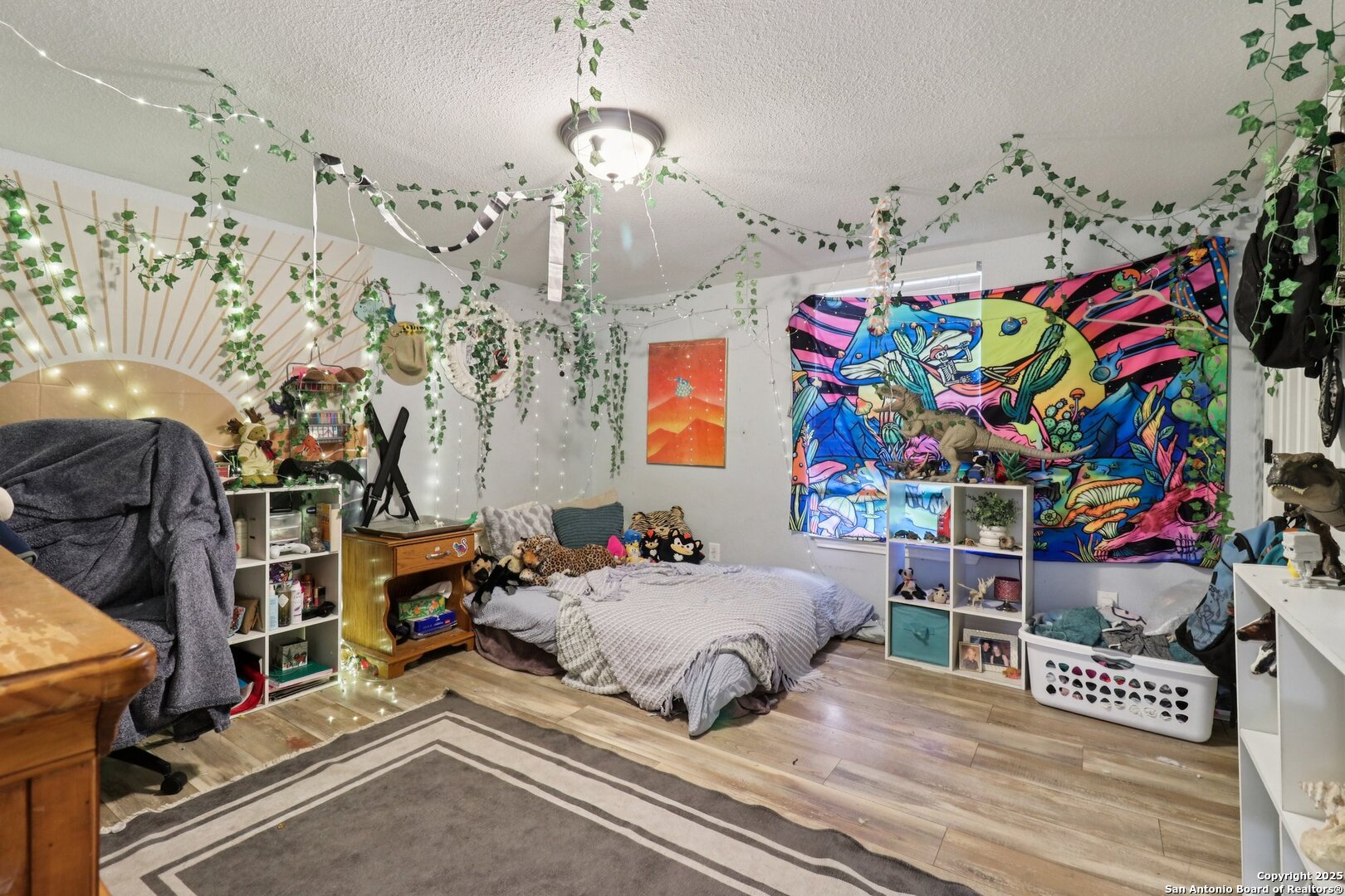 503 Mockingbird Lane Devine, TX 78016 - Photo 24 of 49 a bedroom with bed and a window