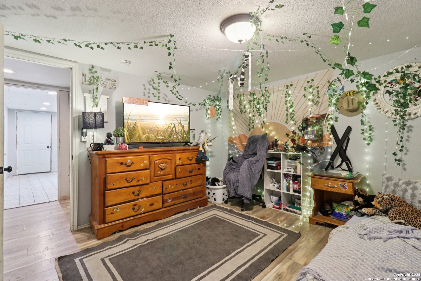 503 Mockingbird Lane Devine, TX 78016 - Photo 25 of 49 wooden floor in a room
