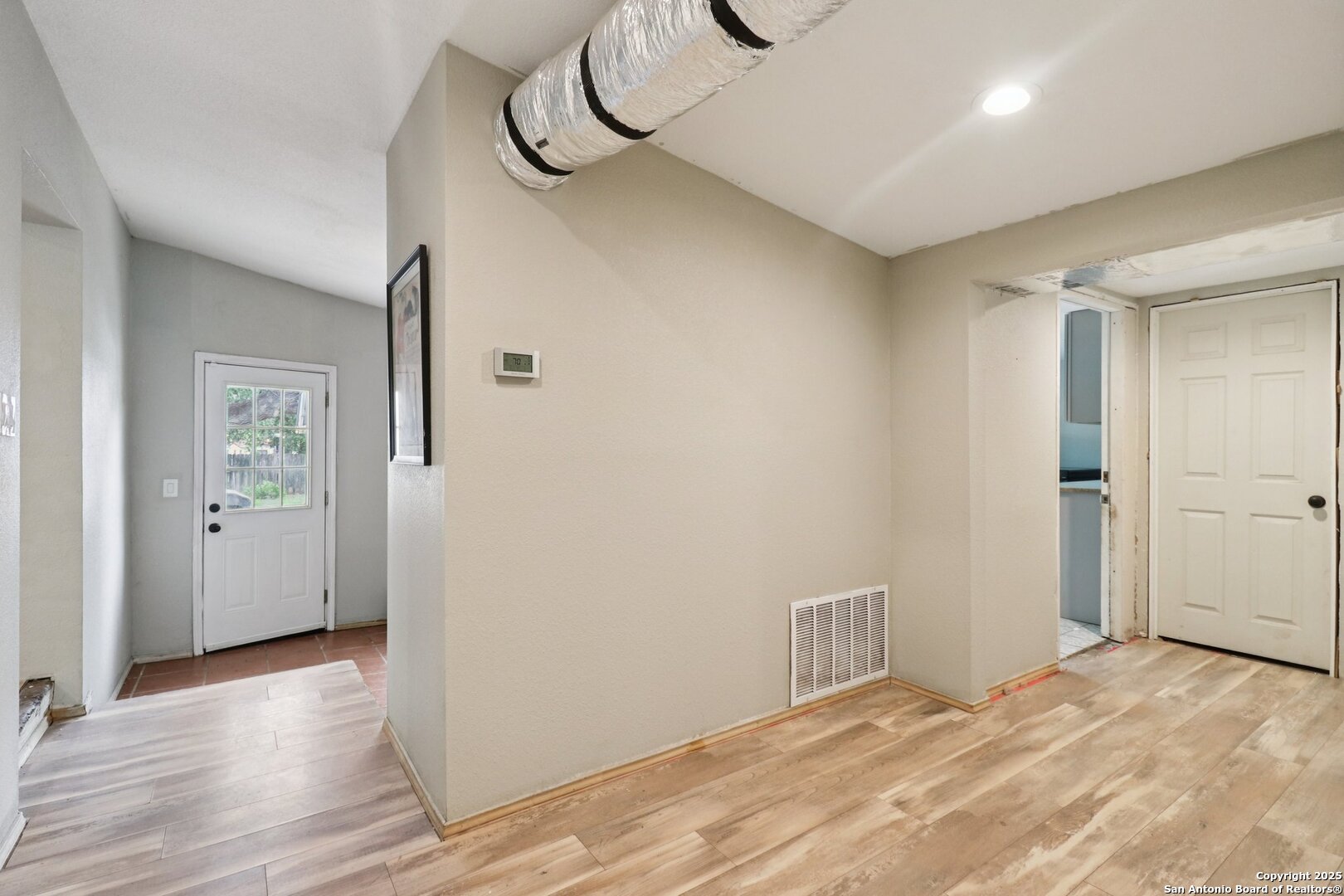 503 Mockingbird Lane Devine, TX 78016 - Photo 26 of 49 a view of a room with wooden floor