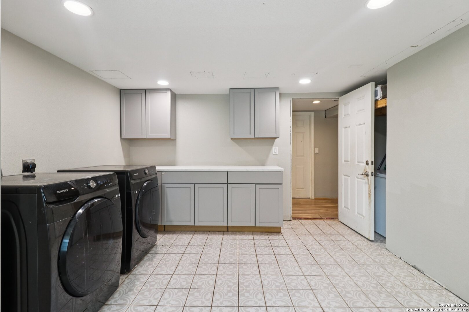 503 Mockingbird Lane Devine, TX 78016 - Photo 29 of 49 a kitchen with a sink a stove and cabinets