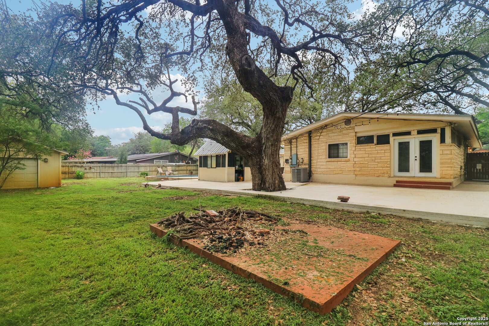 503 Mockingbird Lane Devine, TX 78016 - Photo 30 of 49 a view of a house with a yard