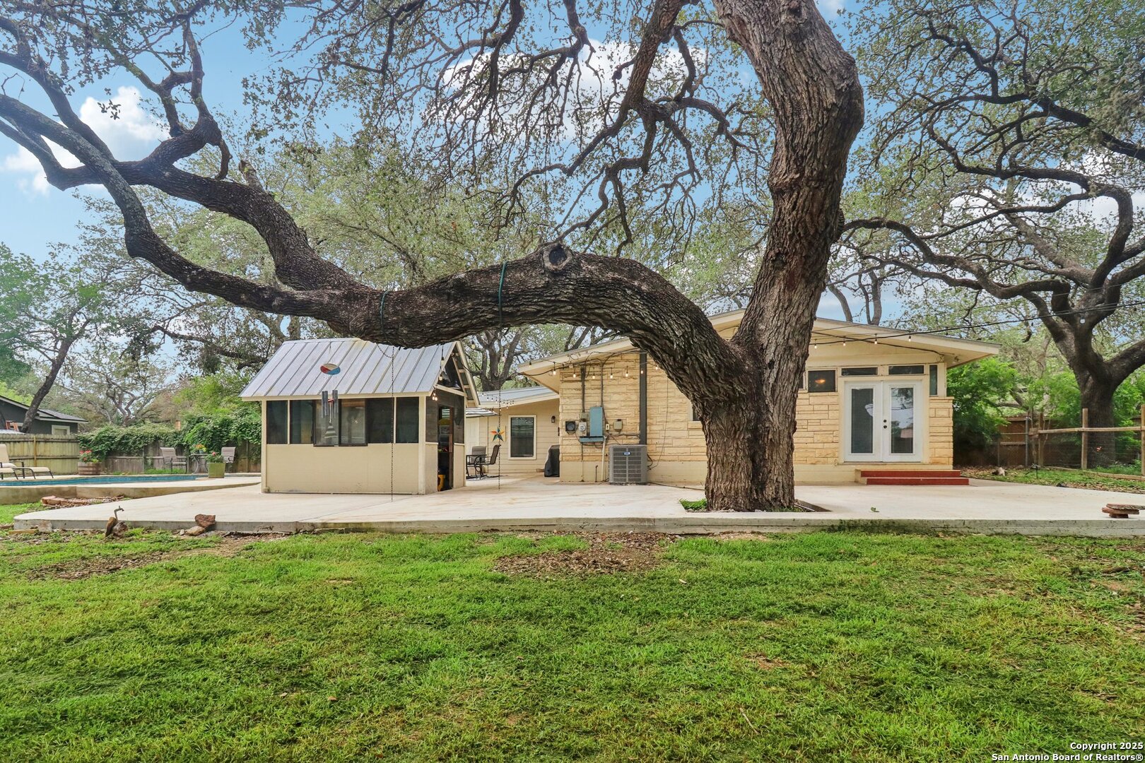 503 Mockingbird Lane Devine, TX 78016 - Photo 31 of 49 a front view of a house with a yard