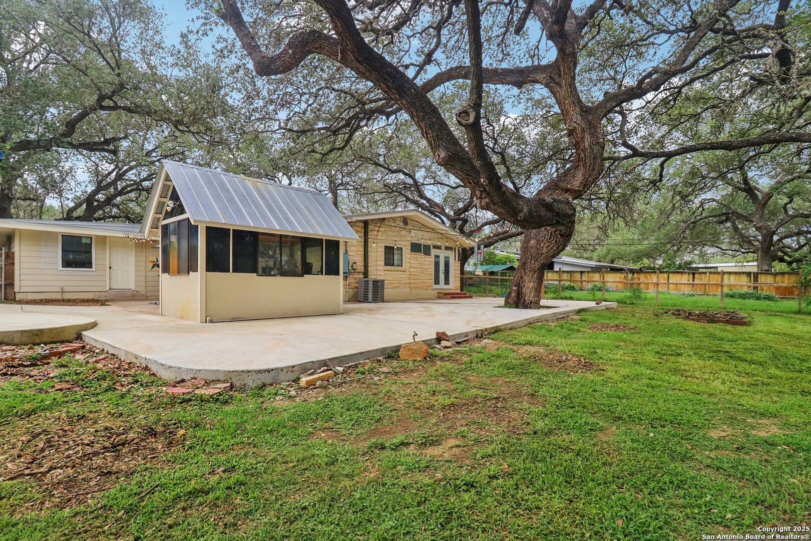 503 Mockingbird Lane Devine, TX 78016 - Photo 32 of 49 a front view of a house with a yard