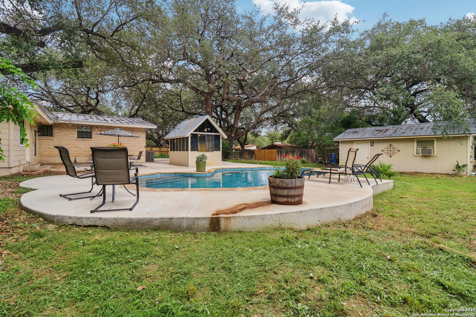 503 Mockingbird Lane Devine, TX 78016 - Photo 36 of 49 a view of the house with backyard porch and sitting area