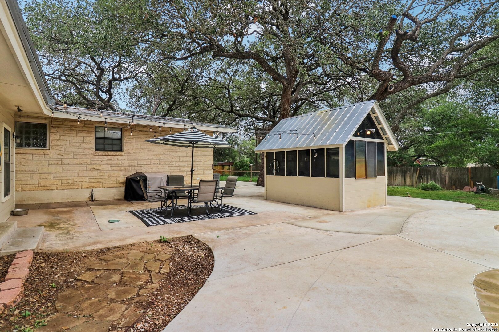 503 Mockingbird Lane Devine, TX 78016 - Photo 37 of 49 a view of house with outdoor seating area