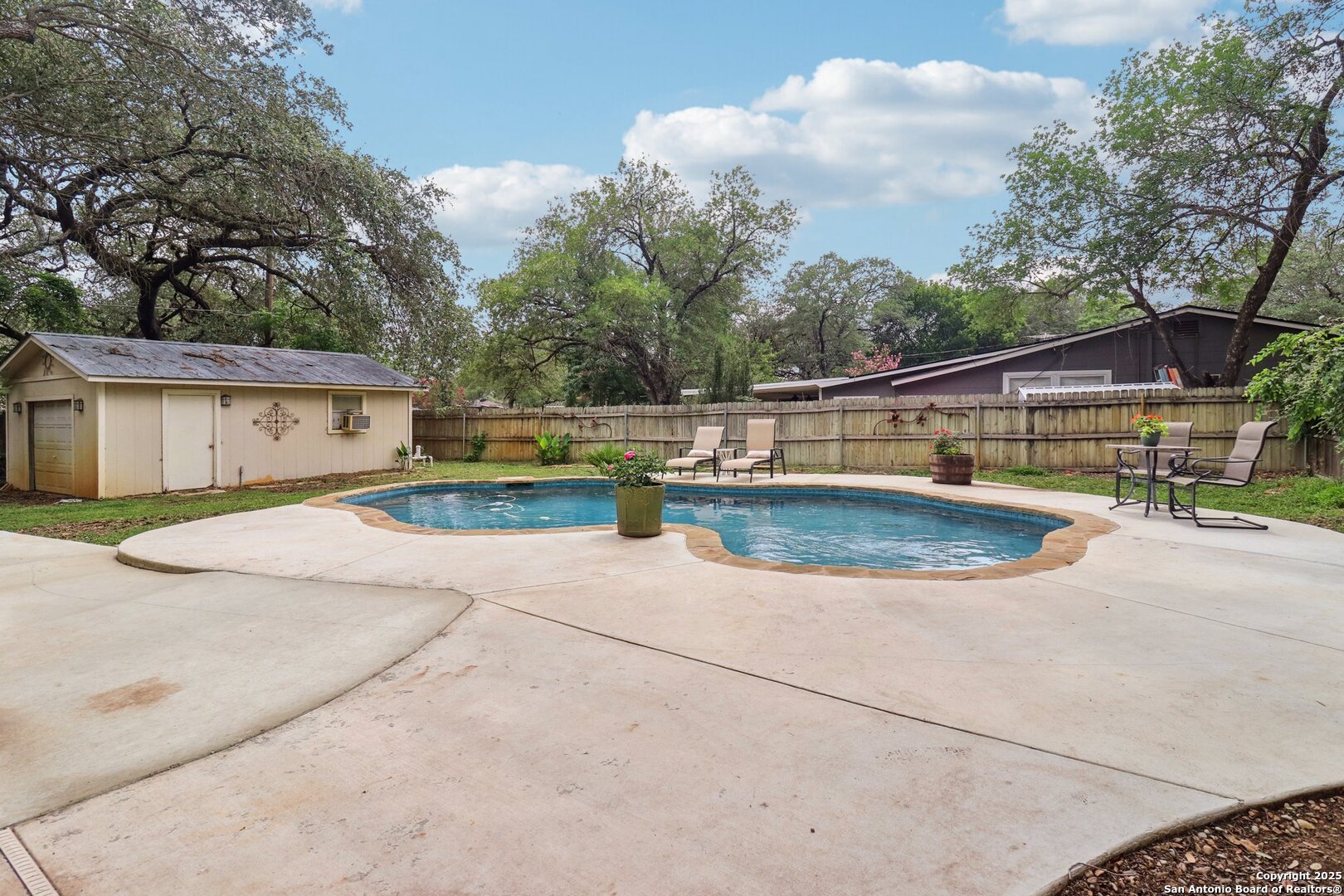 503 Mockingbird Lane Devine, TX 78016 - Photo 39 of 49 a view of a swimming pool with a patio