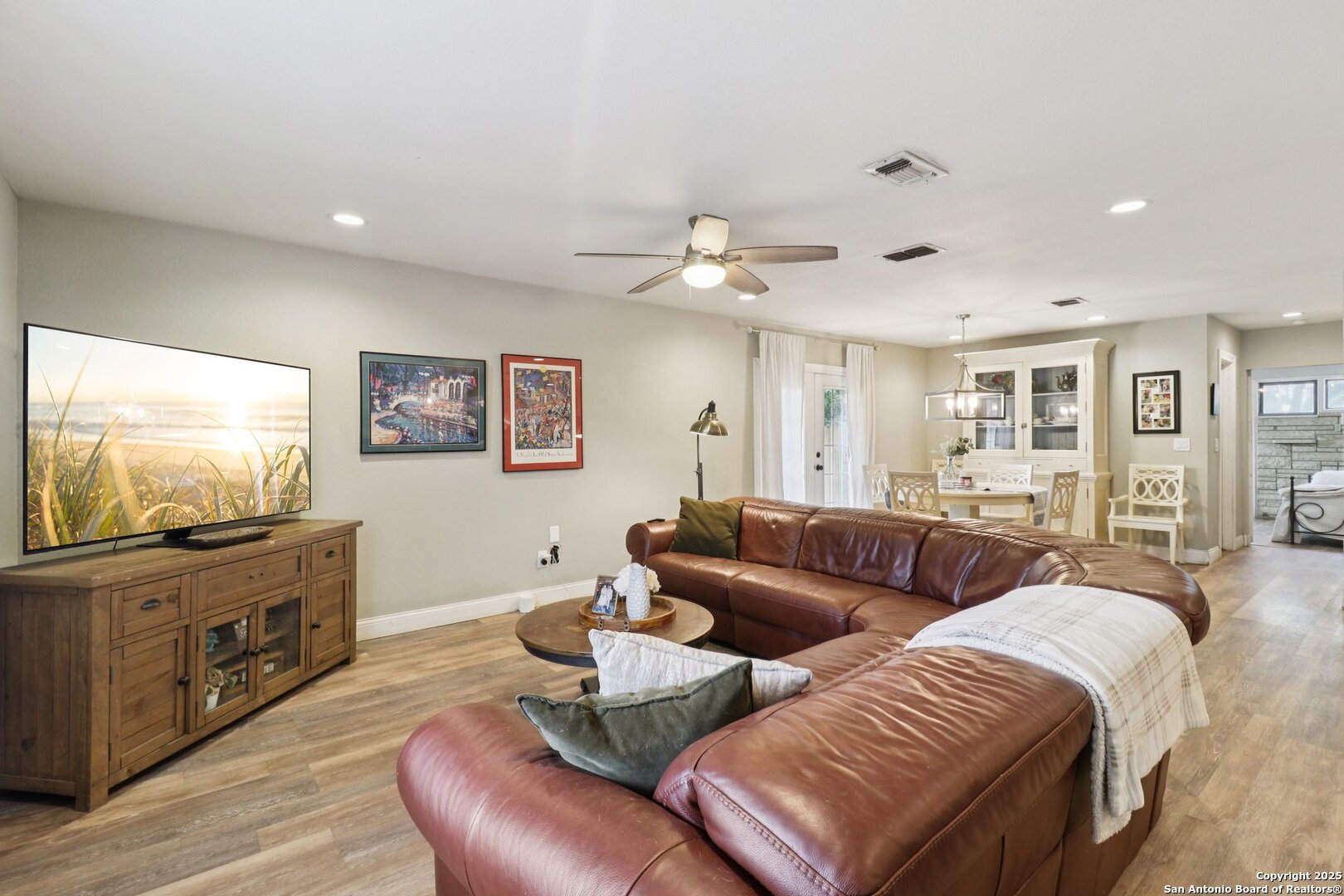 503 Mockingbird Lane Devine, TX 78016 - Photo 4 of 49 a living room with furniture and a flat screen tv