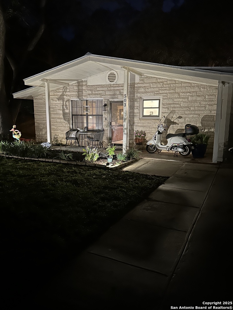 503 Mockingbird Lane Devine, TX 78016 - Photo 45 of 49 a front view of a building with parking space