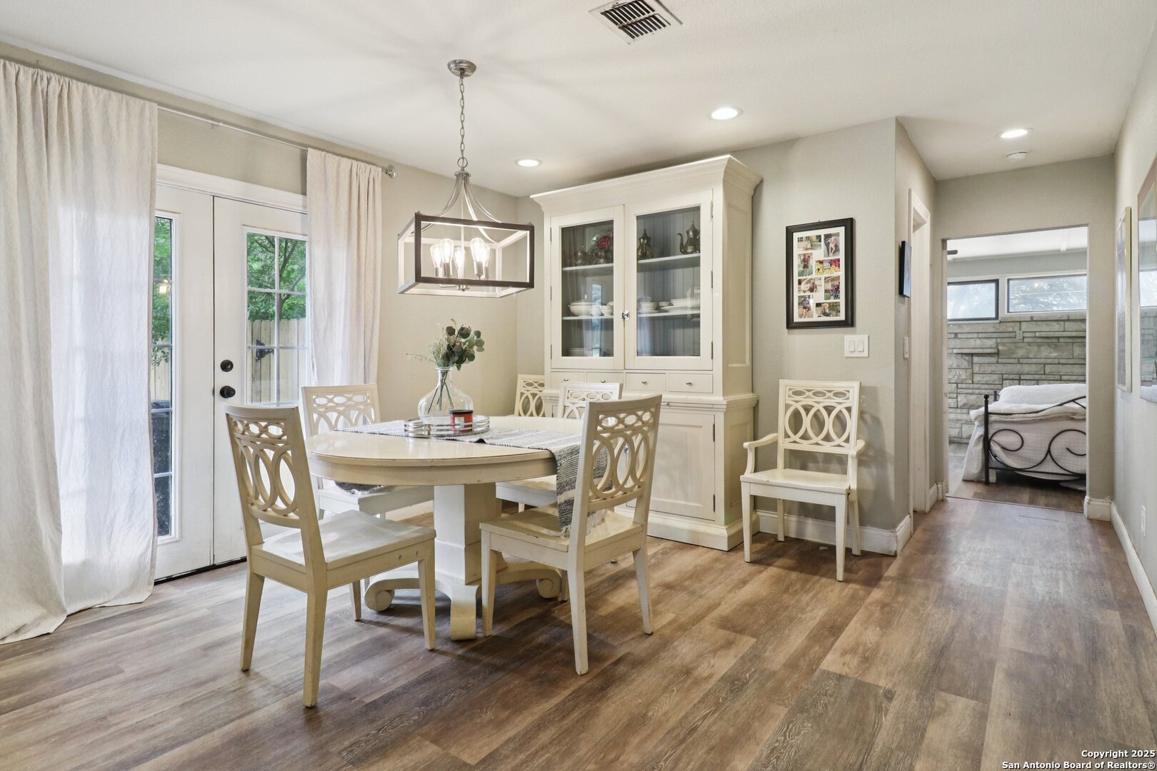 503 Mockingbird Lane Devine, TX 78016 - Photo 6 of 49 a view of a dining room with furniture window and wooden floor