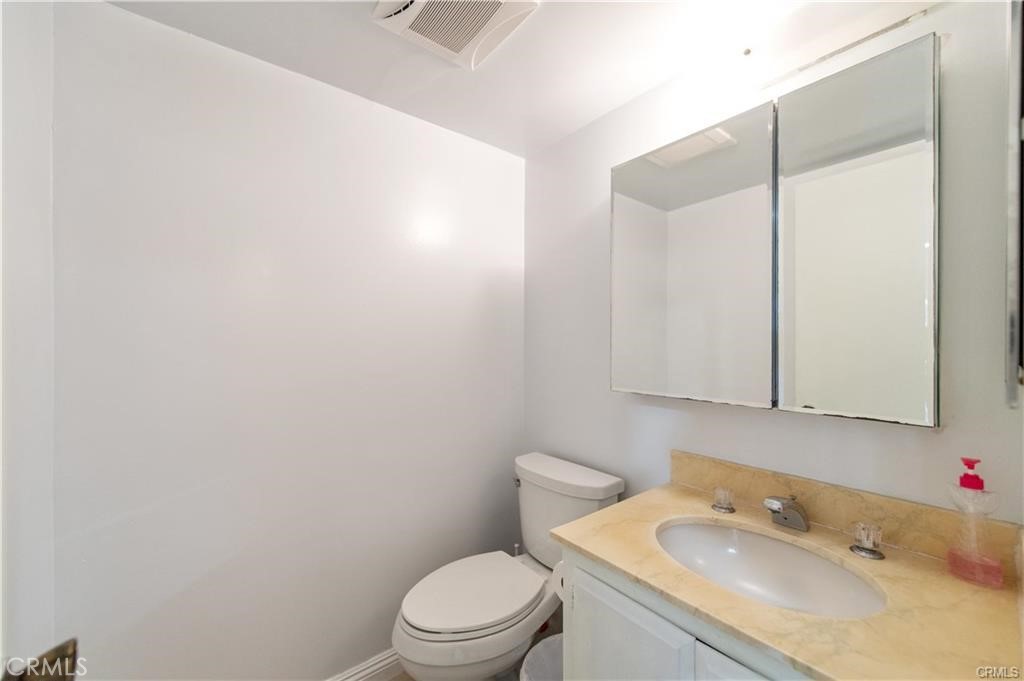 12441 Interior Circle Los Alamitos, CA 90720 - Photo 12 of 26 a bathroom with a sink and a toilet