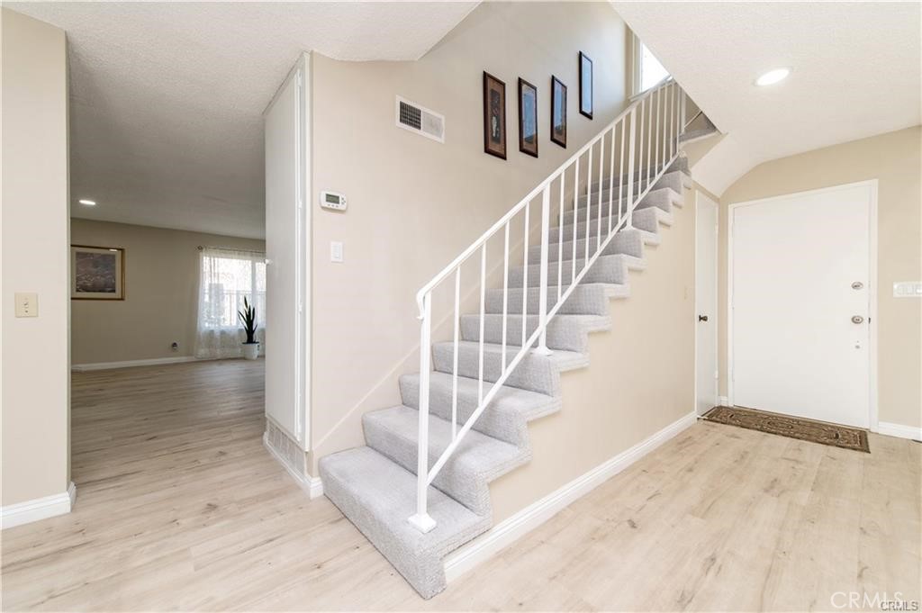 12441 Interior Circle Los Alamitos, CA 90720 - Photo 14 of 26 a view of entryway and hall with wooden floor