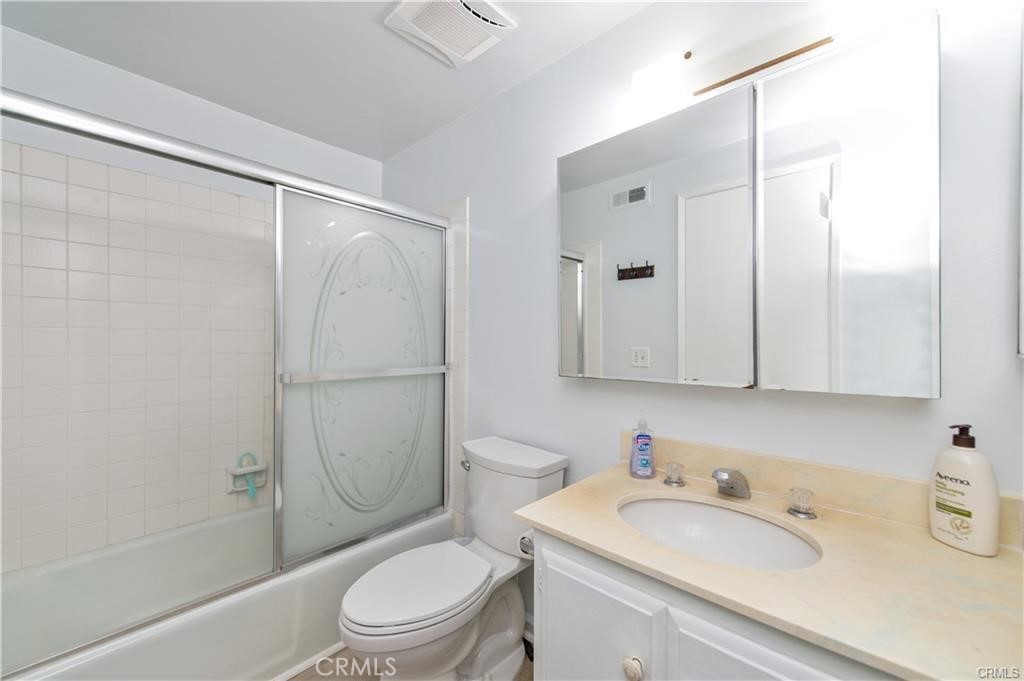 12441 Interior Circle Los Alamitos, CA 90720 - Photo 19 of 26 a bathroom with a sink a toilet and shower