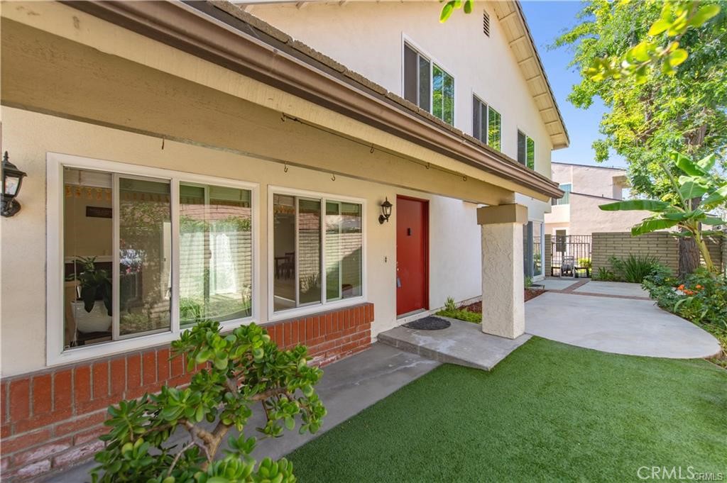 12441 Interior Circle Los Alamitos, CA 90720 - Photo 2 of 26 front view of a house with a yard
