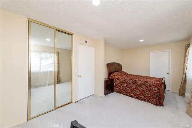 a bedroom with a bed and a table