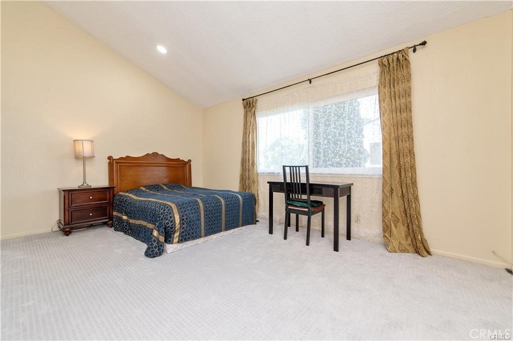 12441 Interior Circle Los Alamitos, CA 90720 - Photo 22 of 26 a bedroom with a bed and a table