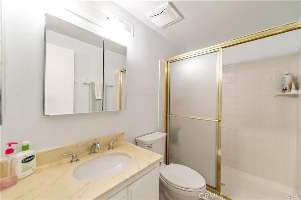 12441 Interior Circle Los Alamitos, CA 90720 - Photo 23 of 26 a bathroom with a sink toilet and shower