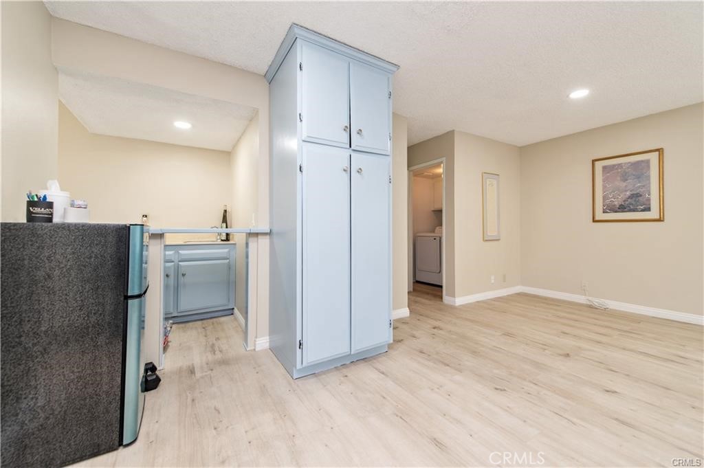 12441 Interior Circle Los Alamitos, CA 90720 - Photo 8 of 26 a view of a kitchen with a sink and a refrigerator