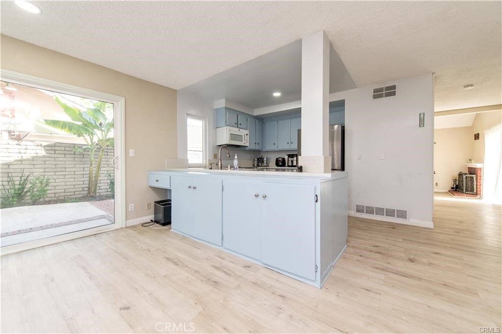 12441 Interior Circle Los Alamitos, CA 90720 - Photo 10 of 26 a kitchen with a sink and a refrigerator