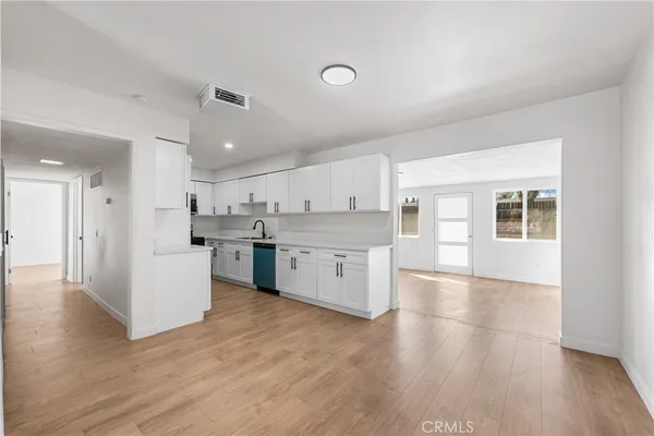 a view of kitchen with wooden floor