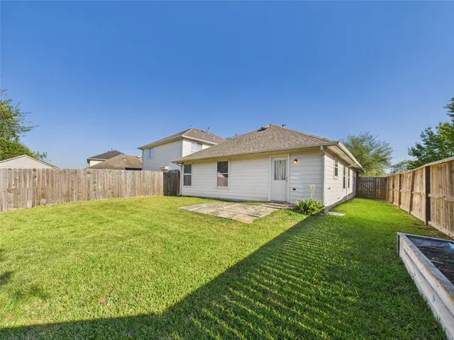a view of a backyard of the house