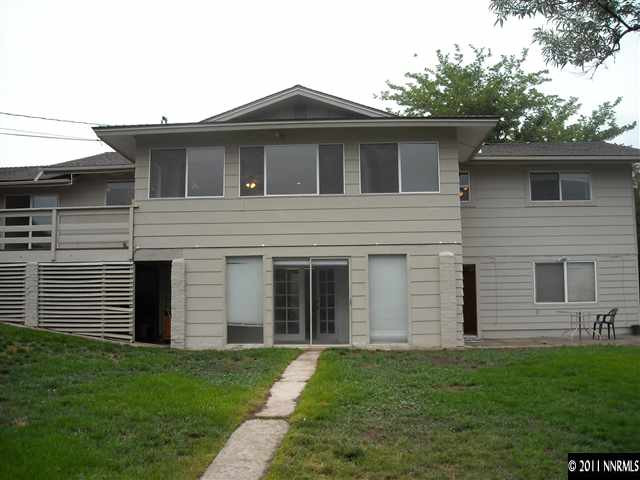 14215 Virginia Foothills Drive Reno, NV 89521 - Photo 11 of 12 a front view of a house with a garden