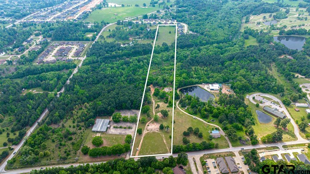 an aerial view of house with a swimming pool