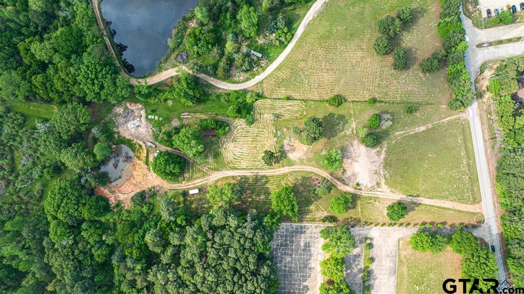 4119 McCann Road Longview, TX 75605 - Photo 7 of 16 an aerial view of residential house with pool and trees