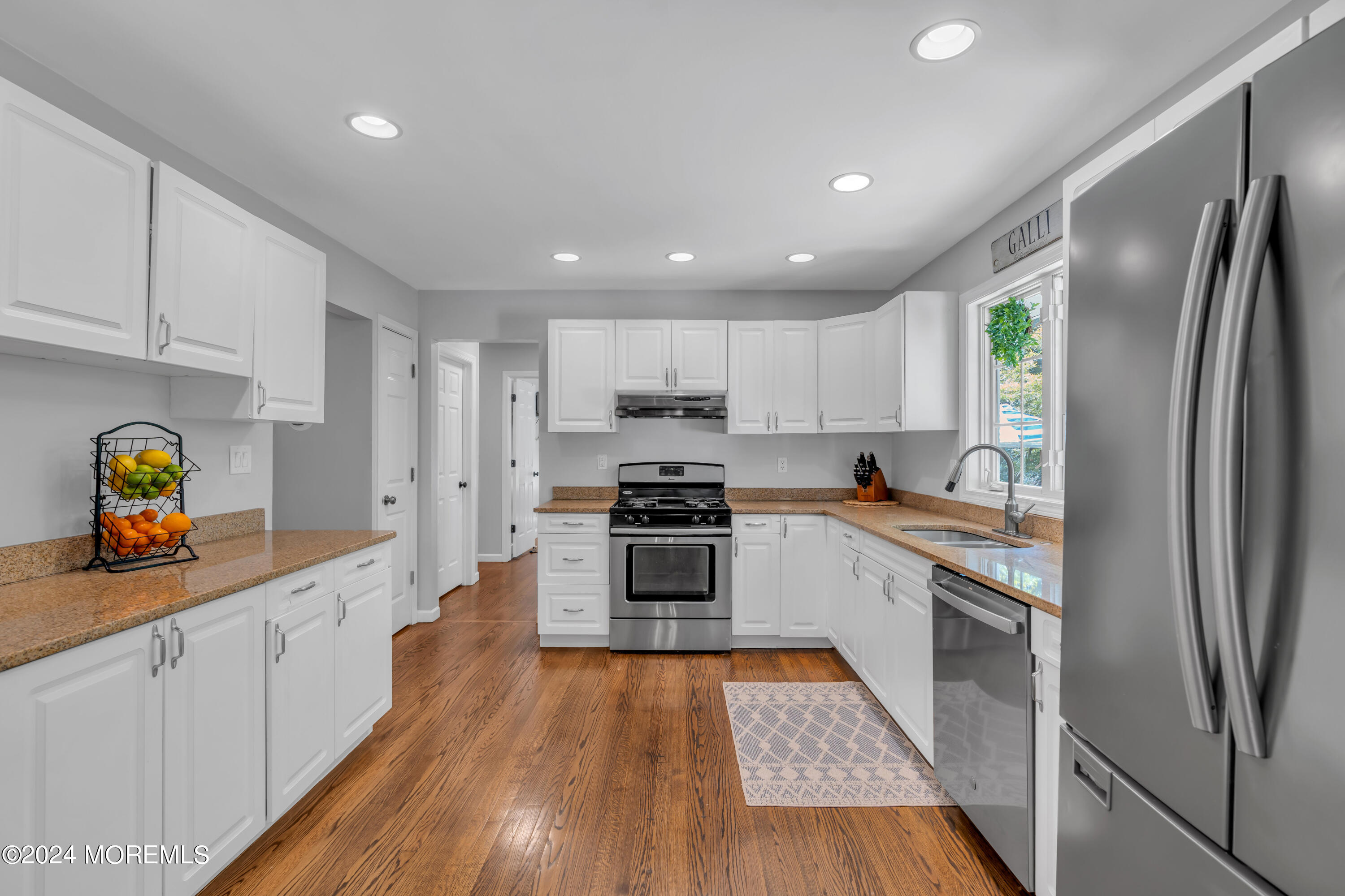104 Five Points Road Colts Neck, NJ 07722 - Photo 14 of 46 a kitchen with stainless steel appliances granite countertop a refrigerator and a stove top oven