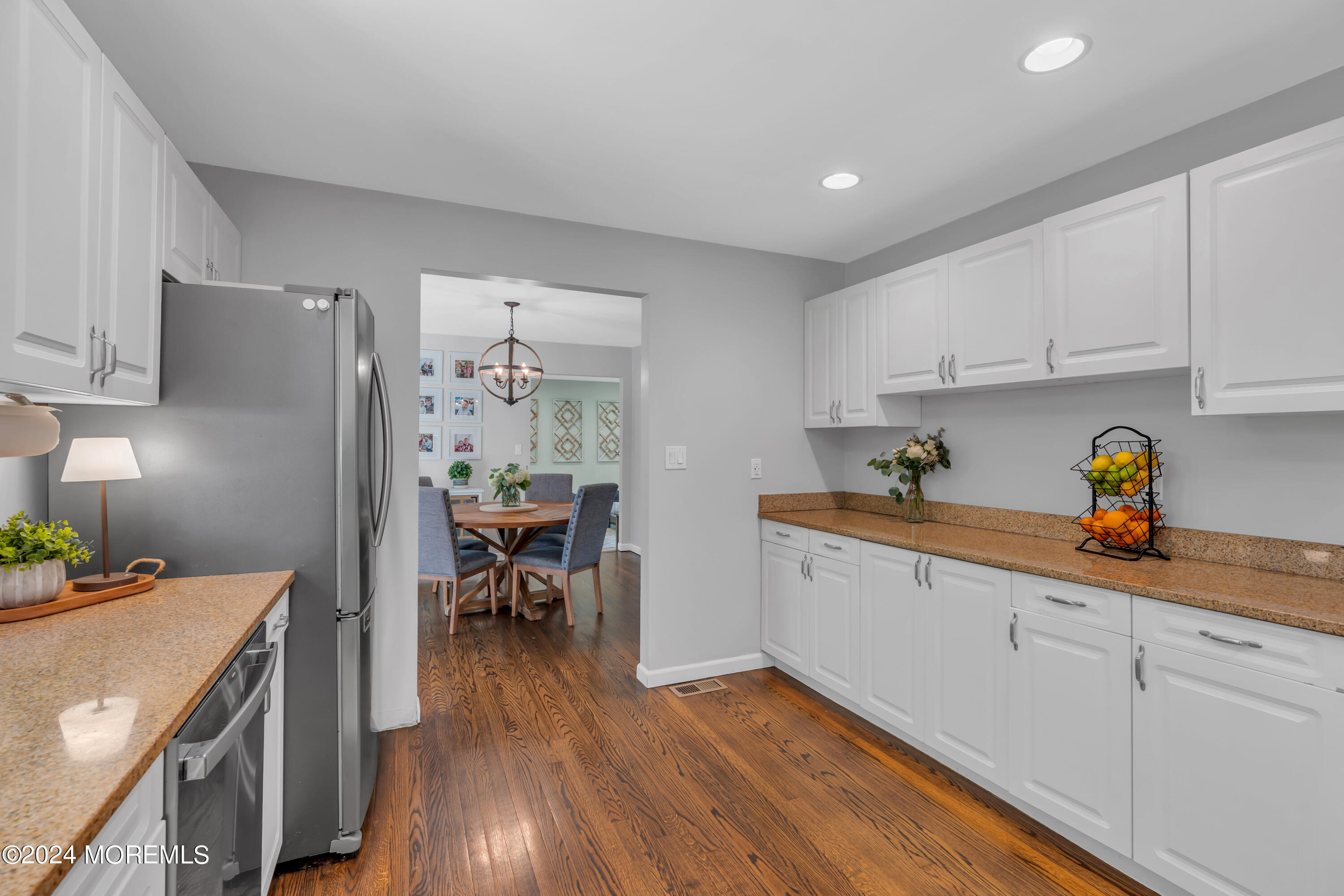104 Five Points Road Colts Neck, NJ 07722 - Photo 16 of 46 a kitchen that has a lot of cabinets a sink and appliances in it