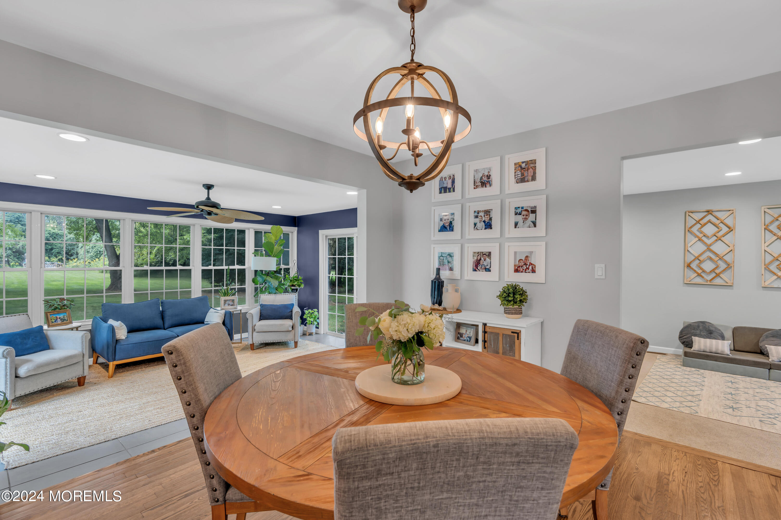 104 Five Points Road Colts Neck, NJ 07722 - Photo 20 of 46 a view of a dining room with furniture large windows and wooden floor