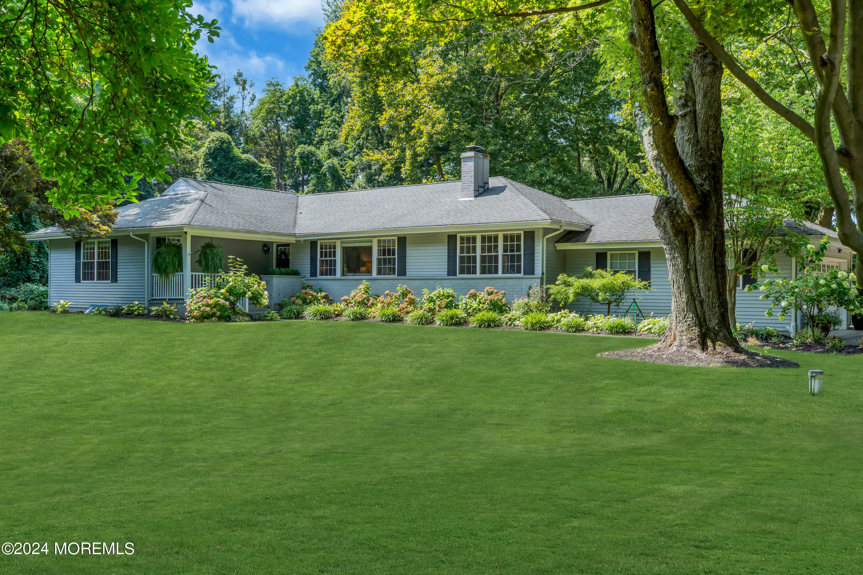 104 Five Points Road Colts Neck, NJ 07722 - Photo 2 of 46 a front view of a house with garden