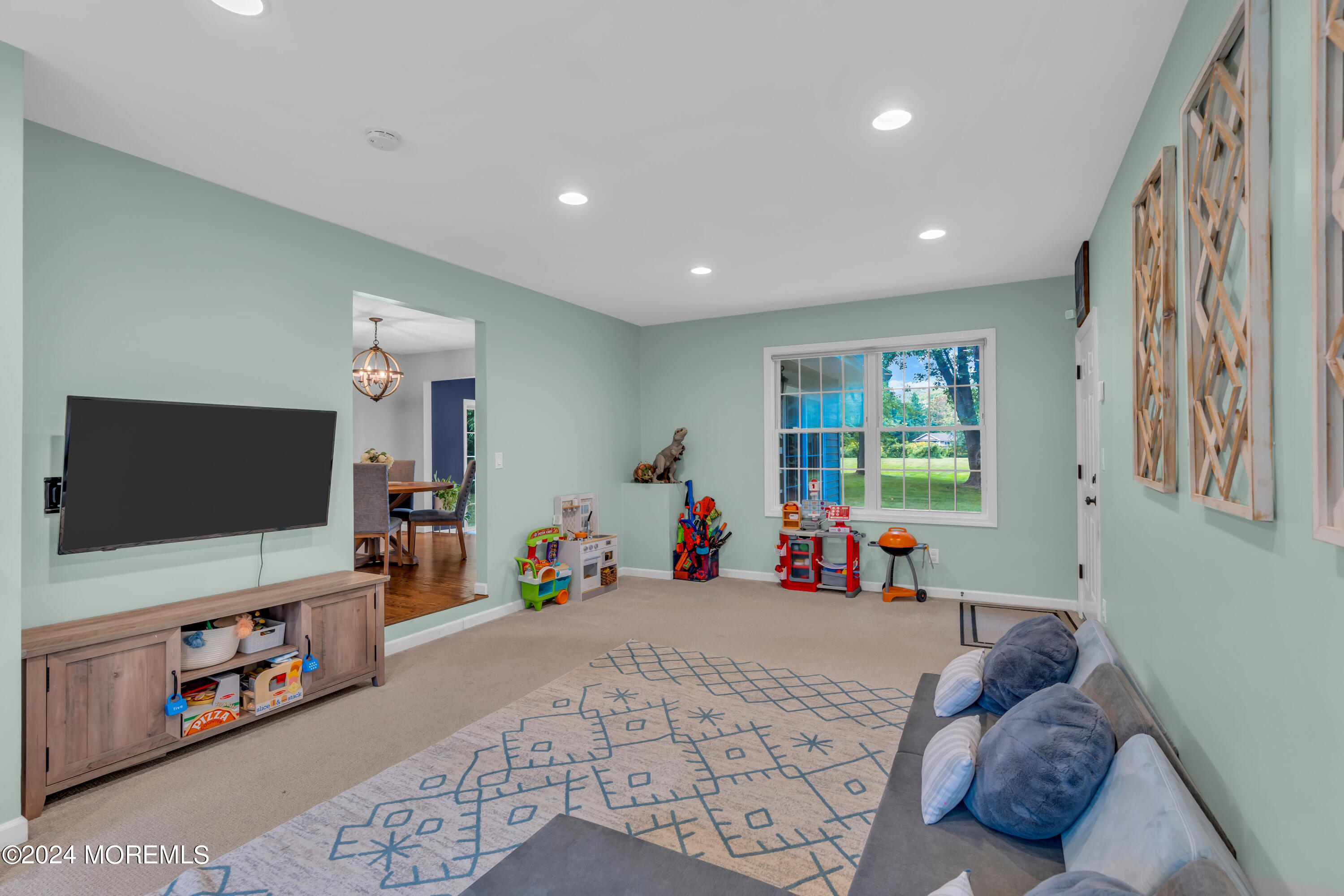 104 Five Points Road Colts Neck, NJ 07722 - Photo 25 of 46 a bedroom with furniture and a flat screen tv