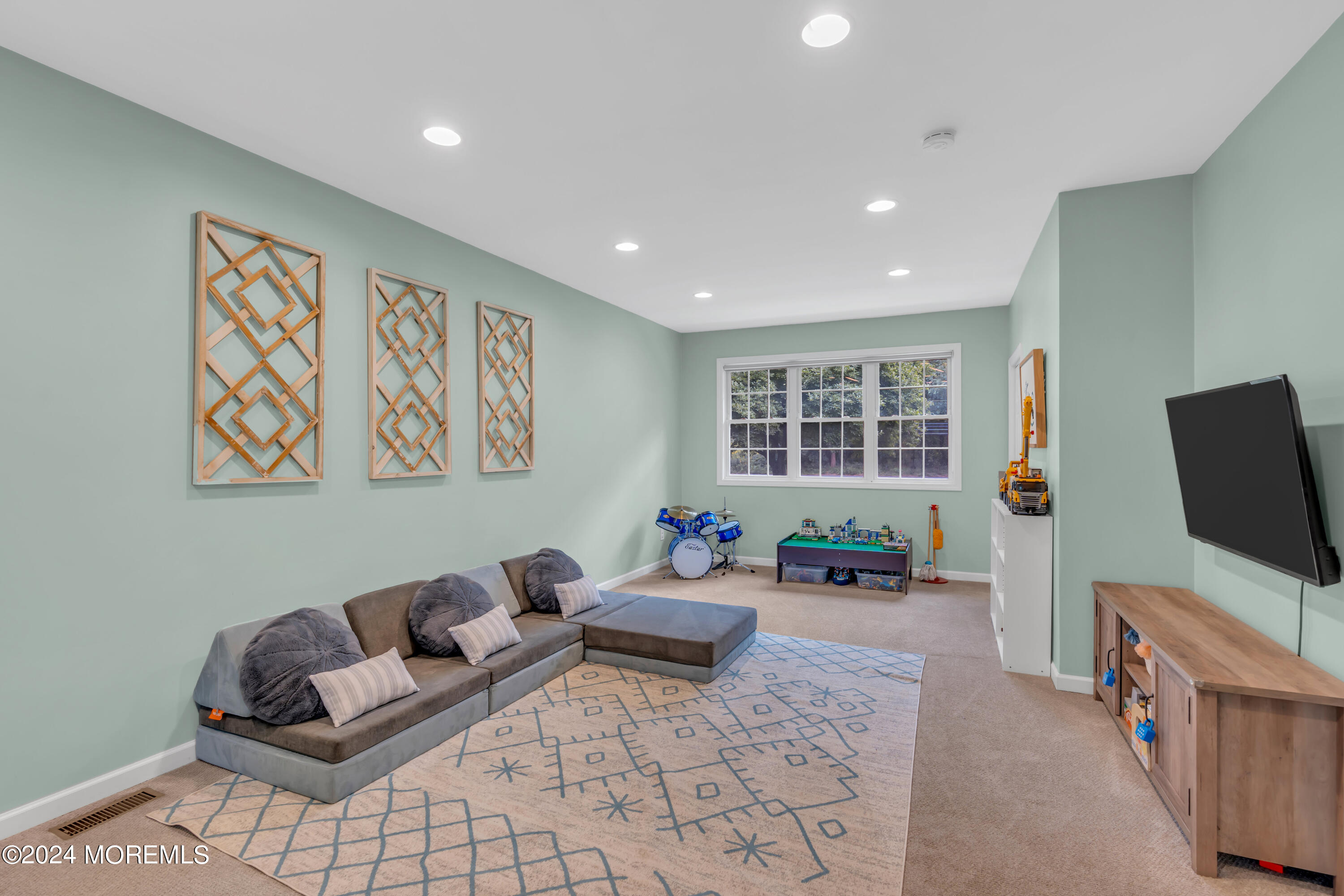 104 Five Points Road Colts Neck, NJ 07722 - Photo 26 of 46 a living room with furniture and a flat screen tv
