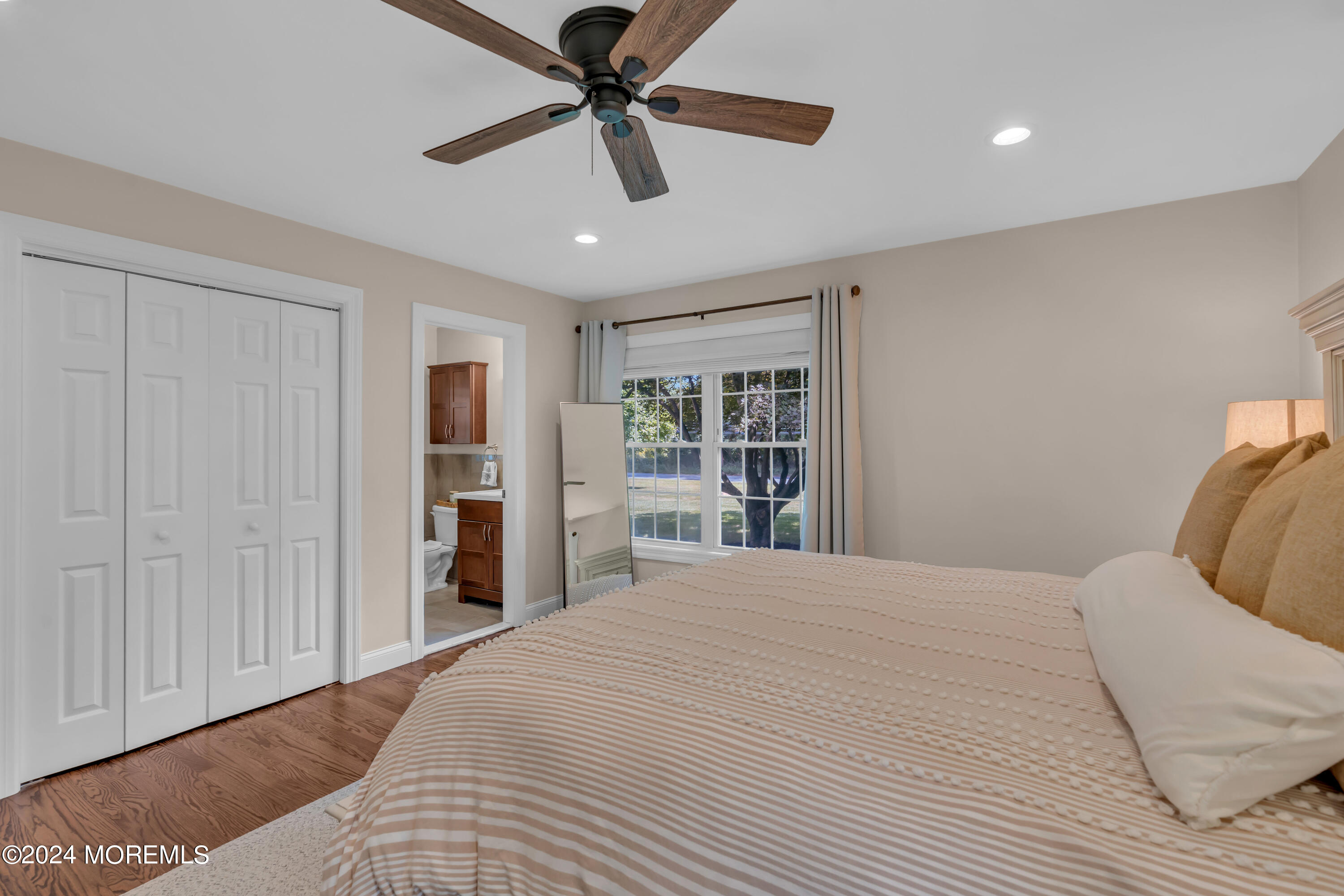 104 Five Points Road Colts Neck, NJ 07722 - Photo 29 of 46 a bedroom with a large bed closet and a window