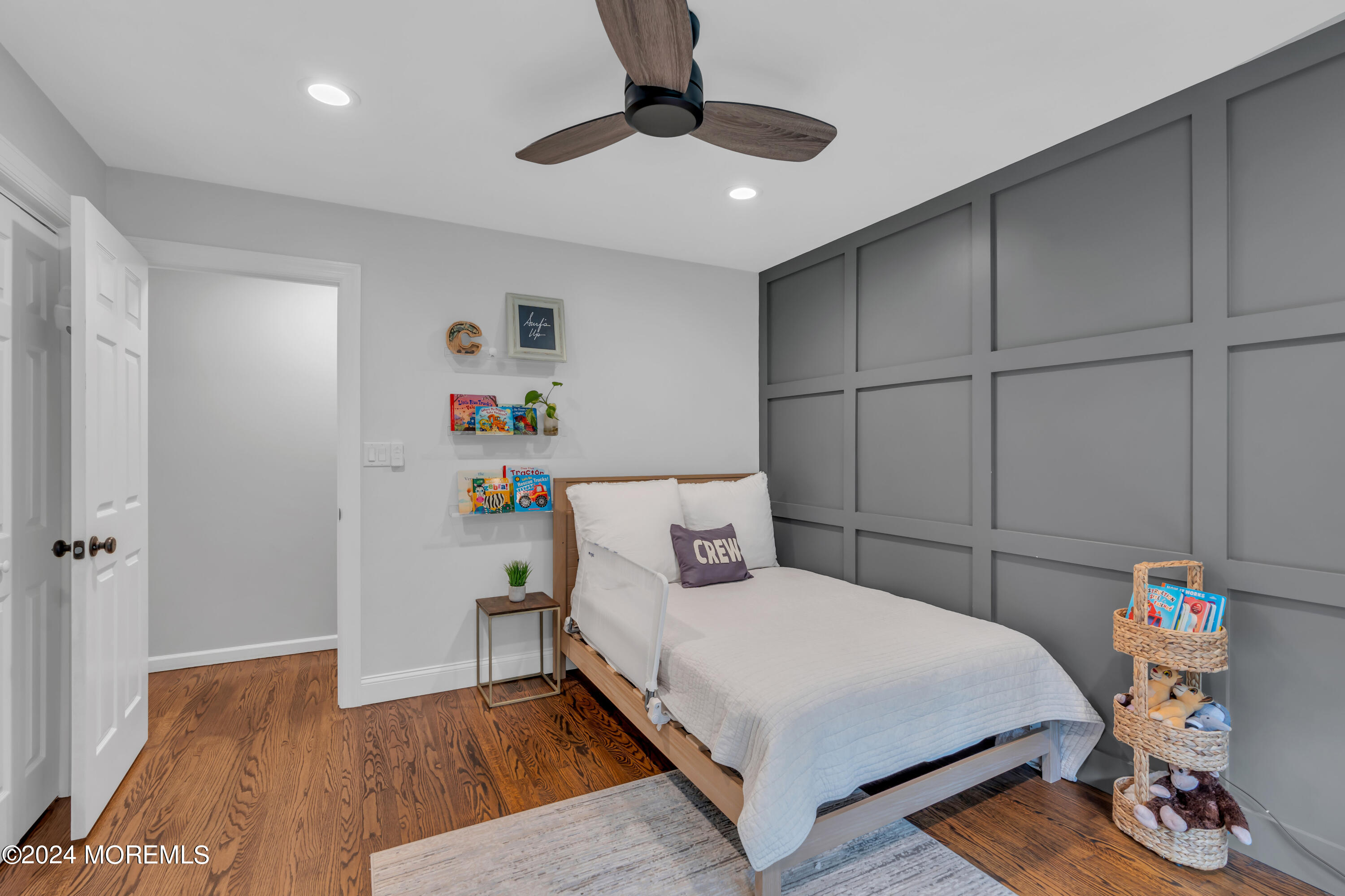 104 Five Points Road Colts Neck, NJ 07722 - Photo 35 of 46 a bedroom with a bed and a chandelier