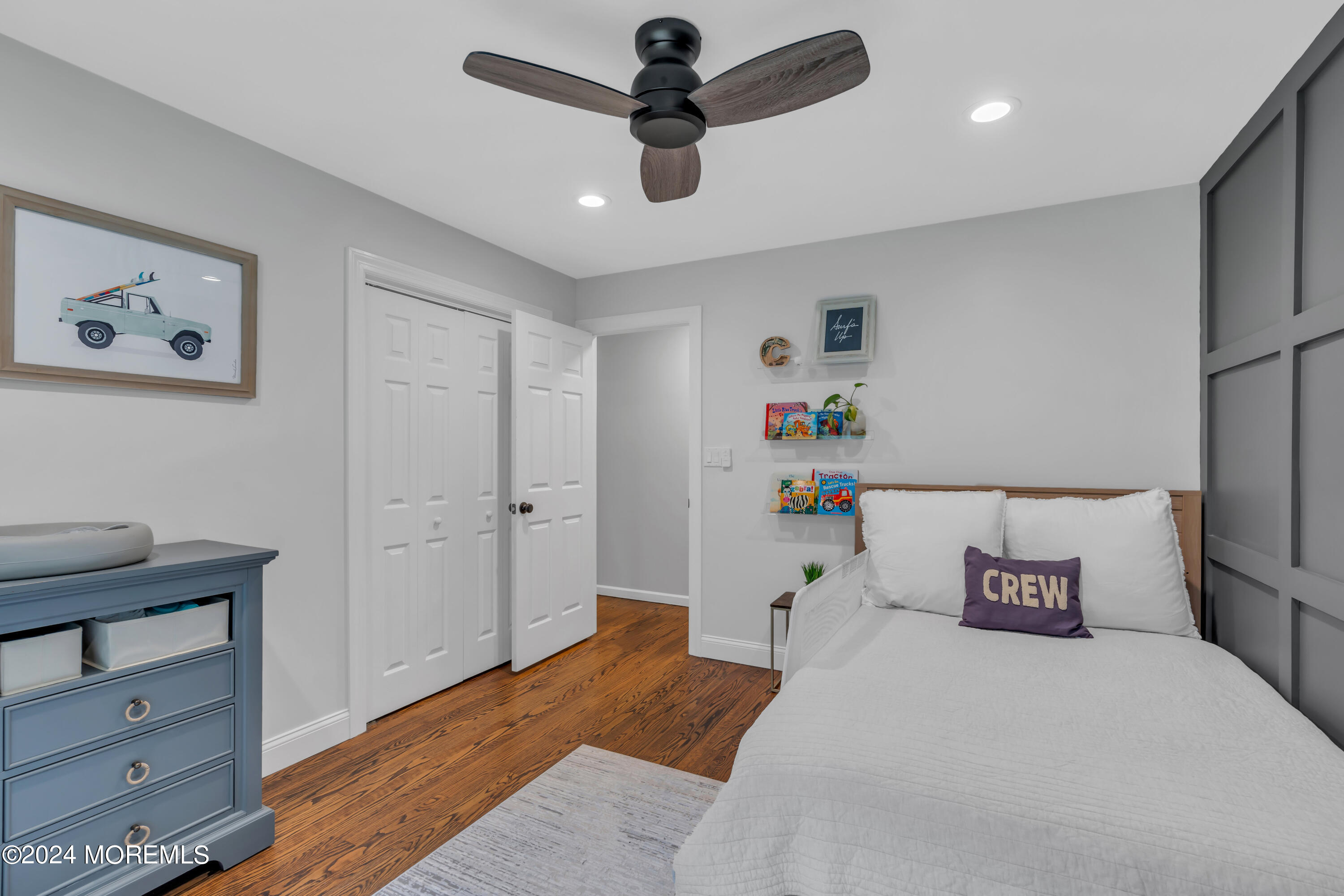 104 Five Points Road Colts Neck, NJ 07722 - Photo 37 of 46 a bedroom with a bed and a chandelier