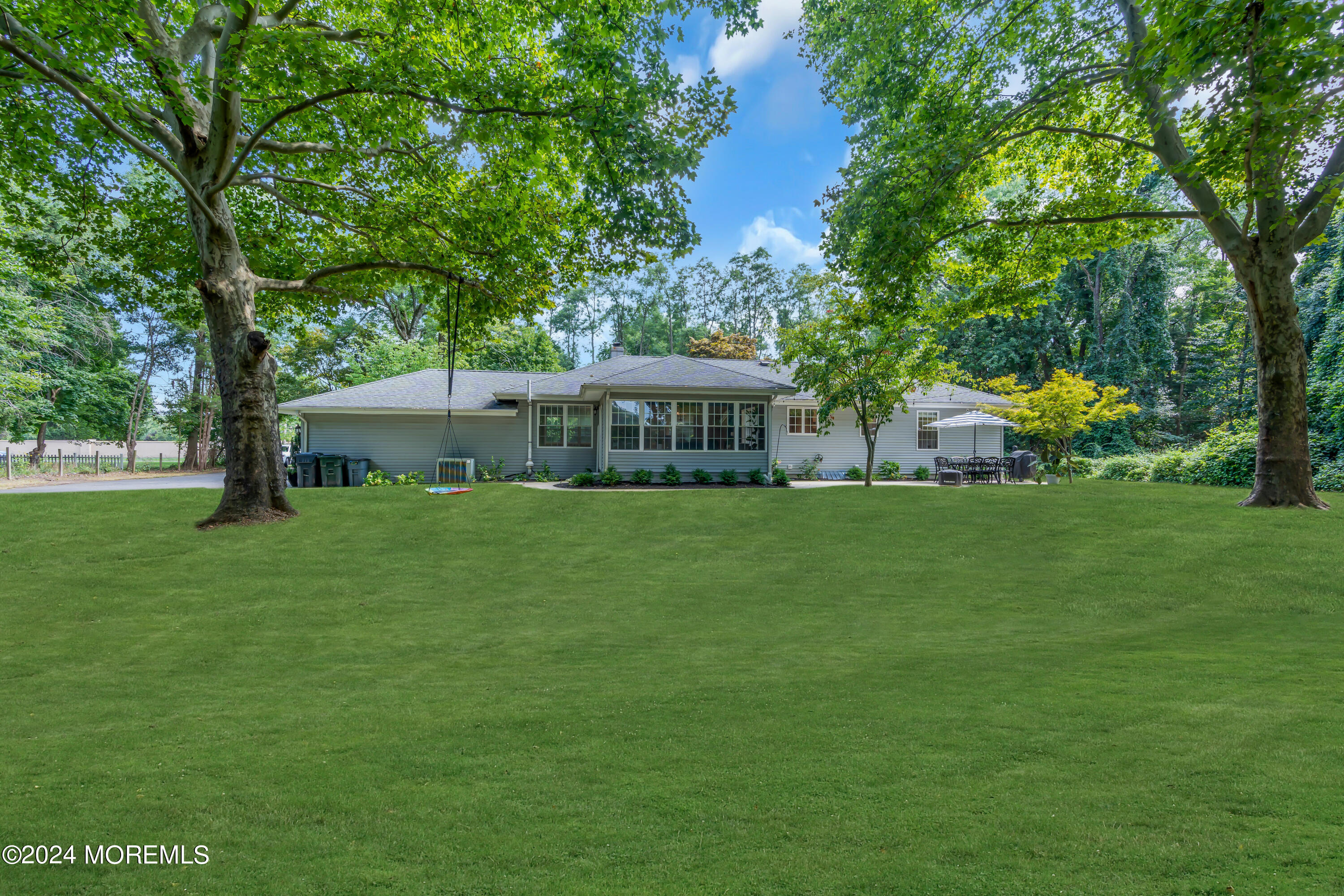 104 Five Points Road Colts Neck, NJ 07722 - Photo 43 of 46 a front view of a house with a garden