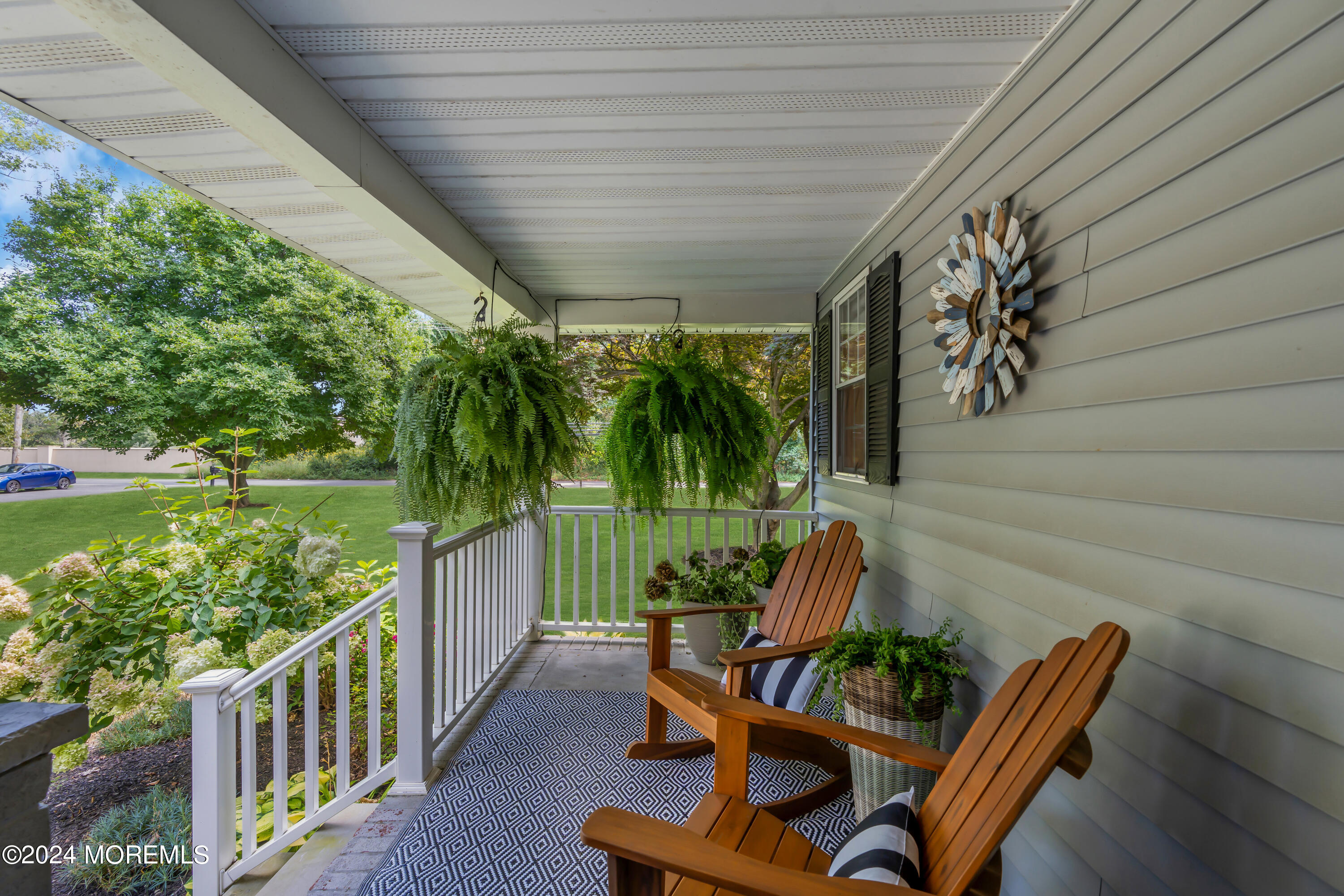 104 Five Points Road Colts Neck, NJ 07722 - Photo 5 of 46 a view of a porch with furniture and a yard