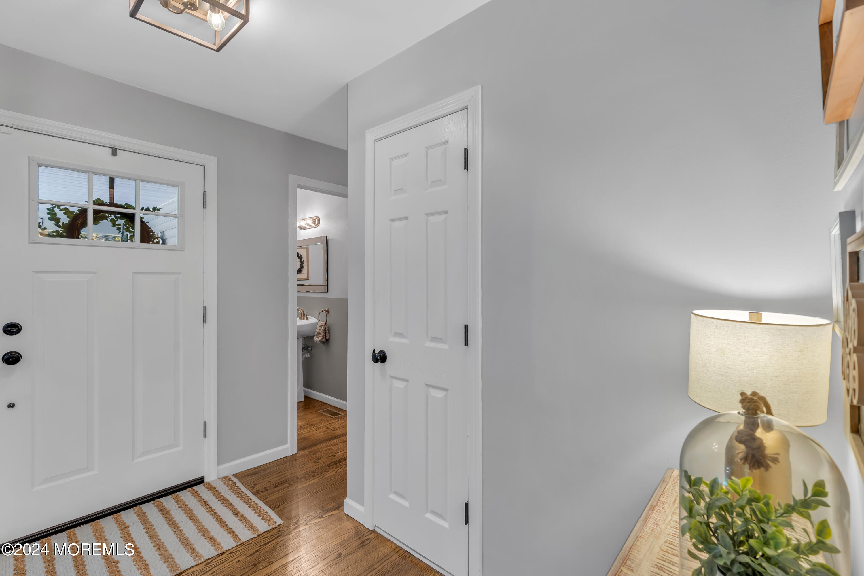 104 Five Points Road Colts Neck, NJ 07722 - Photo 7 of 46 a view of a hallway to rooms and wooden floor
