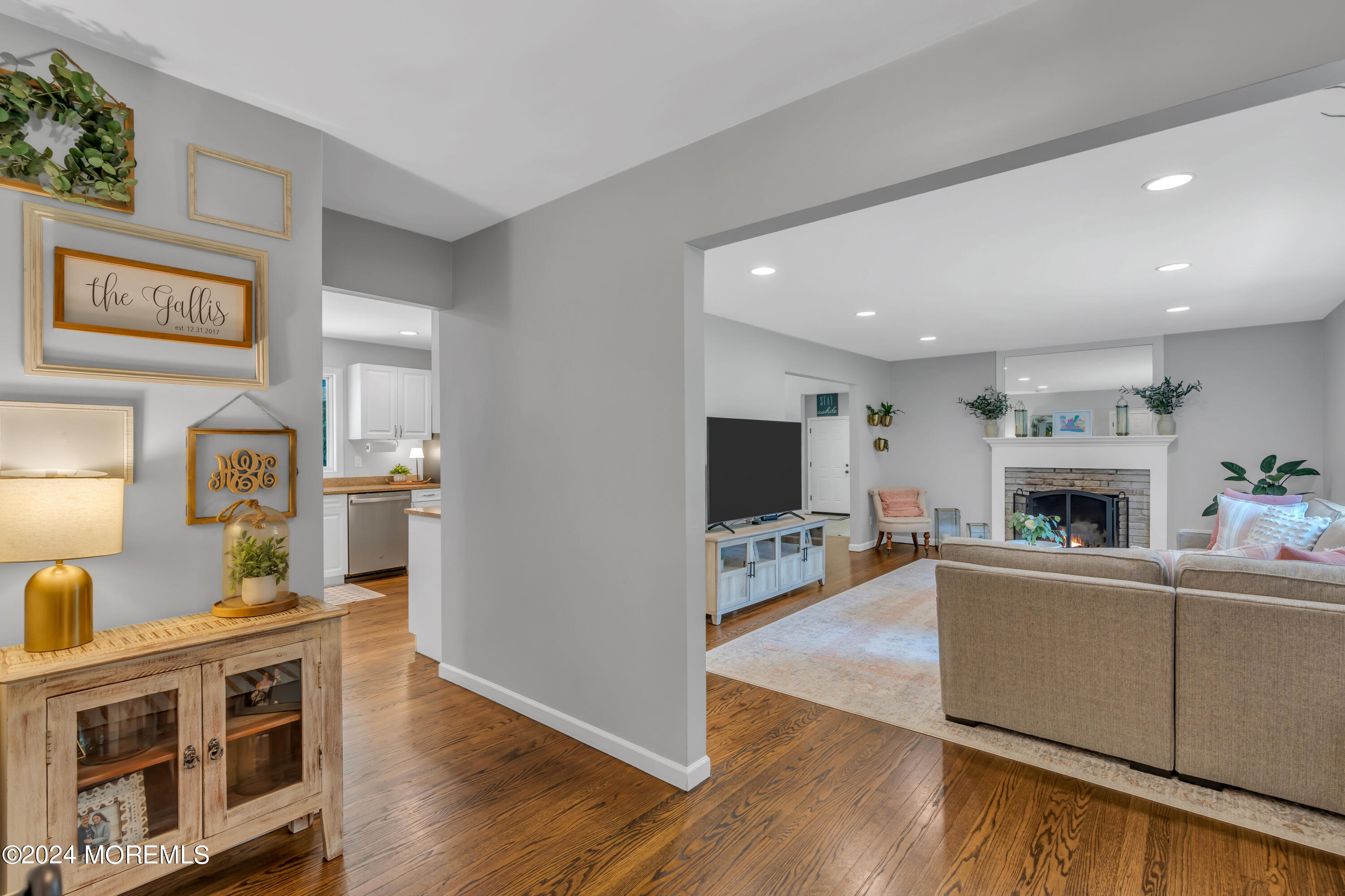 104 Five Points Road Colts Neck, NJ 07722 - Photo 8 of 46 a living room with furniture a flat screen tv and a fireplace