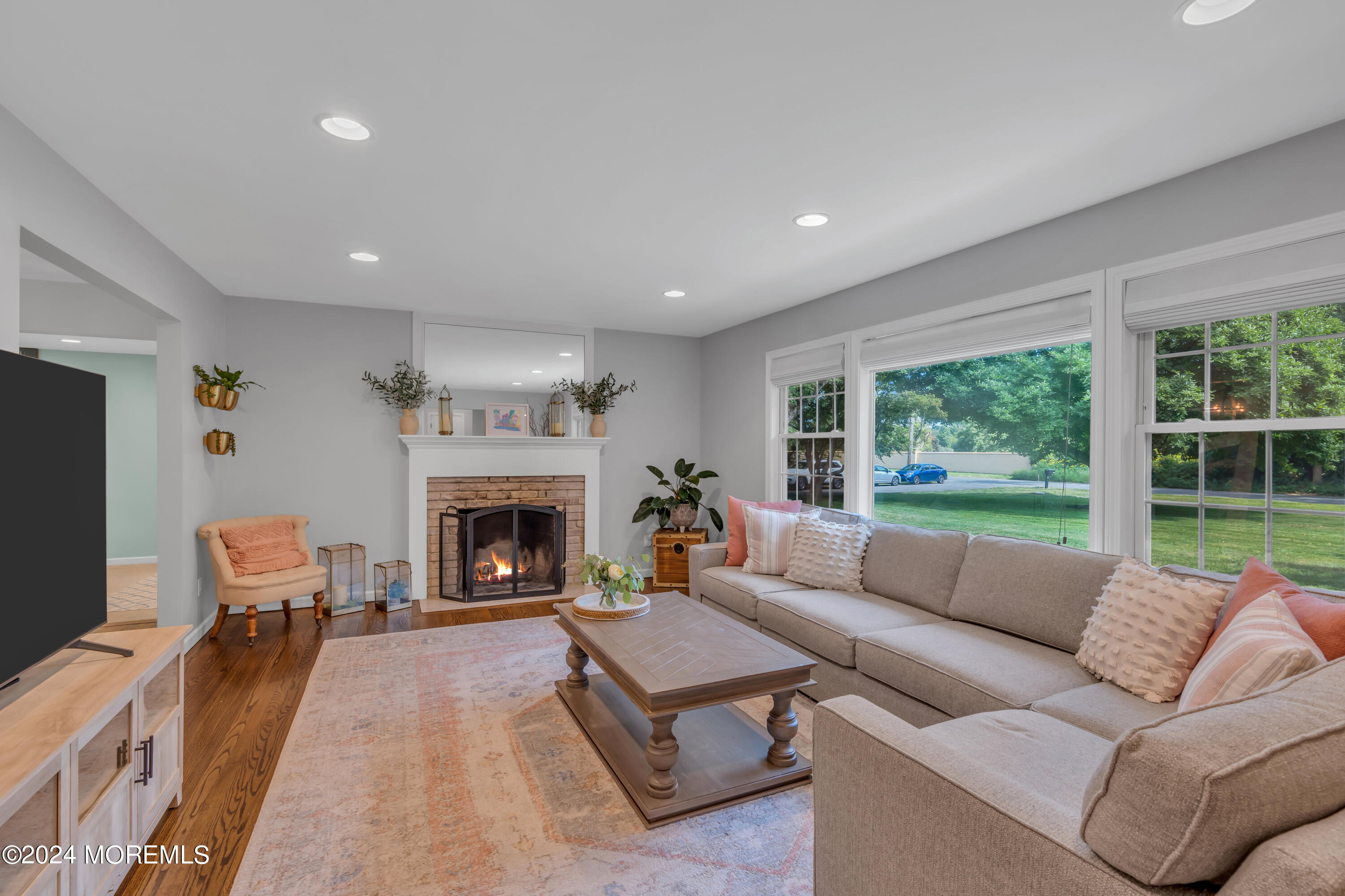104 Five Points Road Colts Neck, NJ 07722 - Photo 10 of 46 a living room with furniture and a fireplace