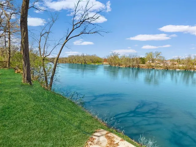 a view of a lake with a yard