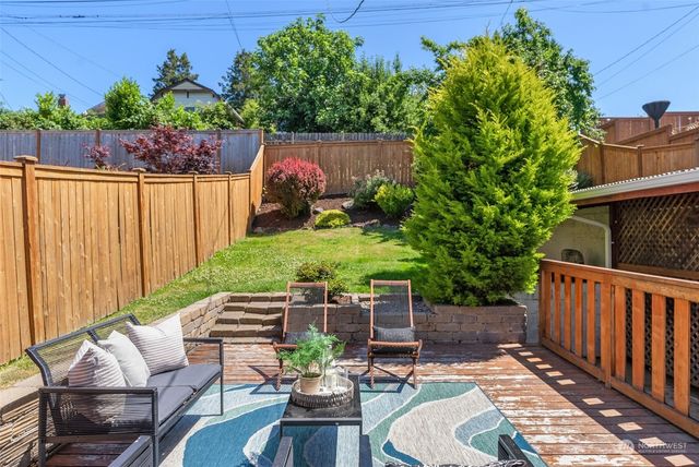 swimming pool view with a seating space
