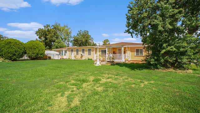 a view of a house with a big yard