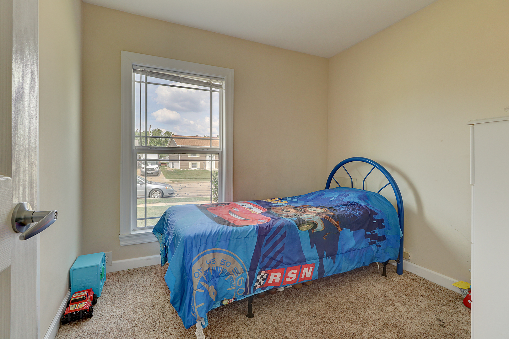 231 Murphy Drive Romeoville, IL 60446 - Photo 11 of 14 a bedroom with a bed and a window
